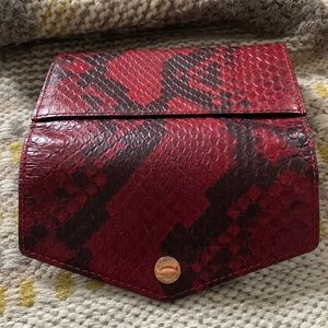 Michael Kors red snakeskin clutch. No strap. ID/CC pockets, interior zip pocket